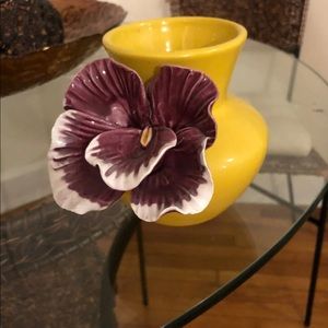 Golden vase with purple flower accent